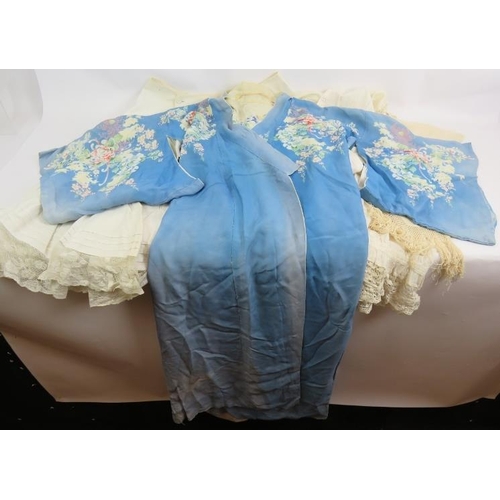 265 - A vintage printed Kimono style robe, a similar Kimono style jacket, a cotton and lace petticoat, a s... 