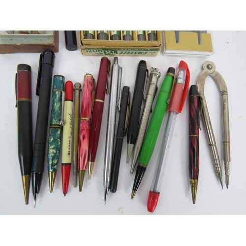 268 - A collection of vintage propelling pens, leads and a compass. Including a rolled gold Yard-o-led pen... 