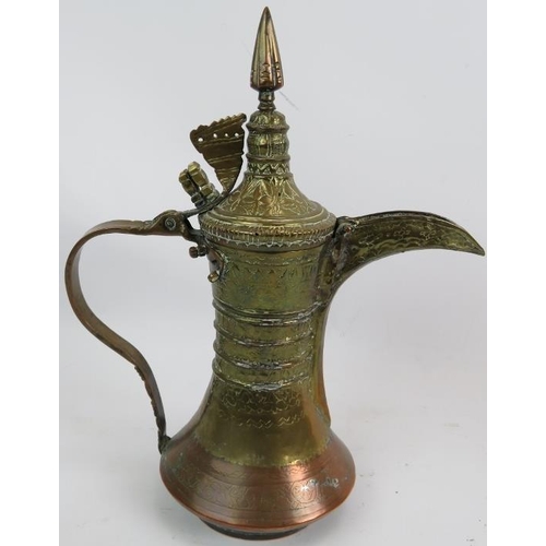 269 - A finely decorated antique copper and brass middle Eastern Dallah  coffee pot and a similar brass Da... 