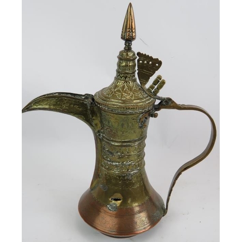 269 - A finely decorated antique copper and brass middle Eastern Dallah  coffee pot and a similar brass Da... 