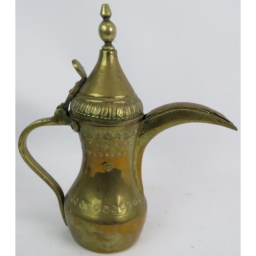 269 - A finely decorated antique copper and brass middle Eastern Dallah  coffee pot and a similar brass Da... 