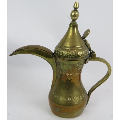 269 - A finely decorated antique copper and brass middle Eastern Dallah  coffee pot and a similar brass Da... 