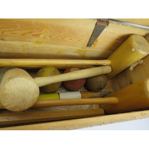 270 - A Jaques & Sons full size croquet set in box, complete with four mallets, four balls, six hoops etc.