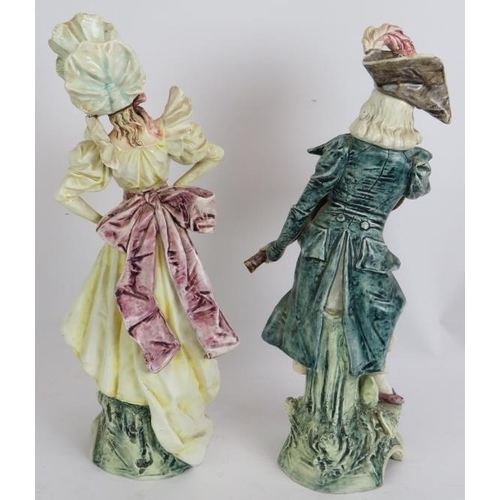 274 - A pair of 19th century continental Majolica figurines of a lady and a minstrel. Both with incised ma... 