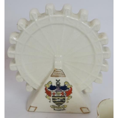 275 - A collection of early 20th century crested ware including the Blackpool big wheel. Maker's including... 