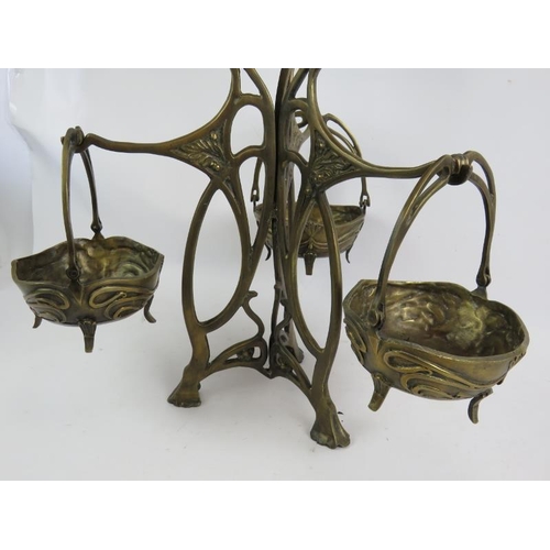 278 - A contemporary Art Nouveau style cast bronze table centre of tripod form consisting of one large bow... 