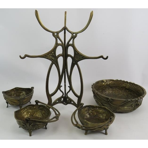 278 - A contemporary Art Nouveau style cast bronze table centre of tripod form consisting of one large bow... 