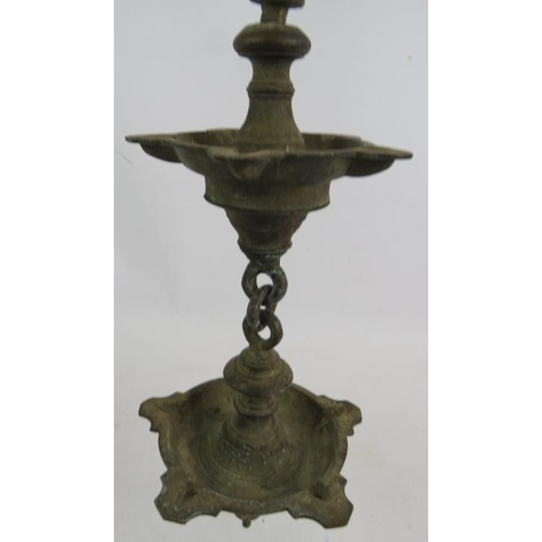 279 - A heavy bronze five section hanging temple oil lamp, each section consisting of five wicks. Overall ... 