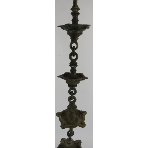 279 - A heavy bronze five section hanging temple oil lamp, each section consisting of five wicks. Overall ... 