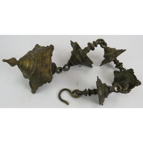 279 - A heavy bronze five section hanging temple oil lamp, each section consisting of five wicks. Overall ... 