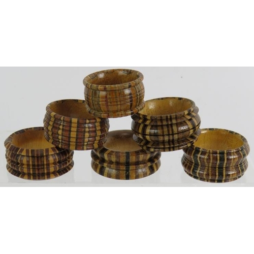 282 - Six mixed Tunbridge ware Treen napkin rings of various size and woods. (6).
Condition report: No iss... 