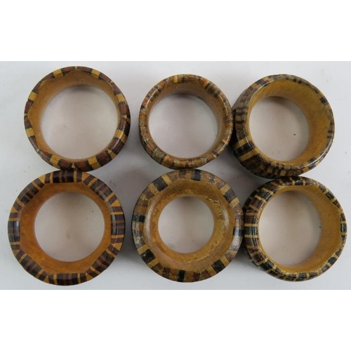 282 - Six mixed Tunbridge ware Treen napkin rings of various size and woods. (6).
Condition report: No iss... 