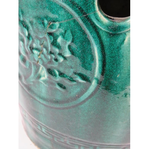 284 - A Chinese green/turquoise glazed ceramic garden seat, relief moulded with birds, foliage and ornamen... 