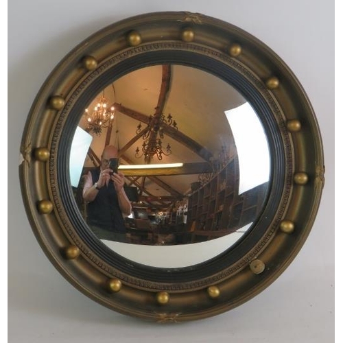 286 - An early 20th Century Atsonea convex mirror in gilt plaster frame. Overall diameter 41cm.
Condition ... 