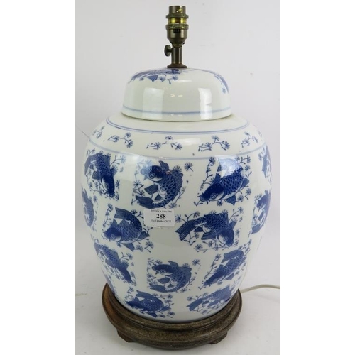 288 - A large contemporary Chinese style blue and white porcelain covered jar lamp with Koi Carp decoratio... 