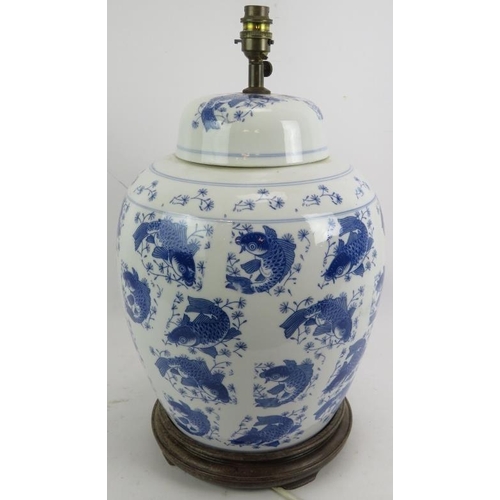 288 - A large contemporary Chinese style blue and white porcelain covered jar lamp with Koi Carp decoratio... 