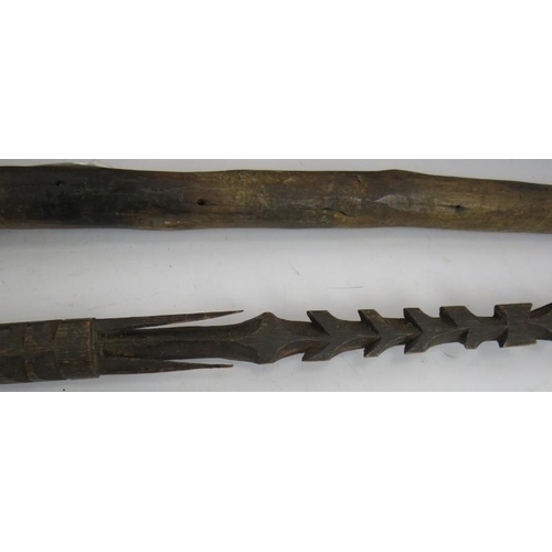 29 - A hand carved Papua New Guinea Harpoon spear, a similar javelin spear, two carved ceremonial spears ... 