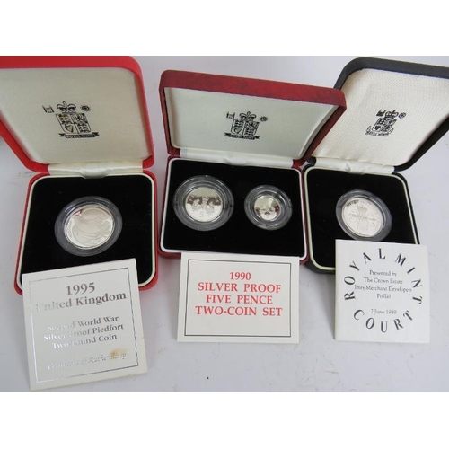 300 - A silver proof US coin set for 1984 Los Angeles Olympics, two proof silver £2 coins, two silver proo... 