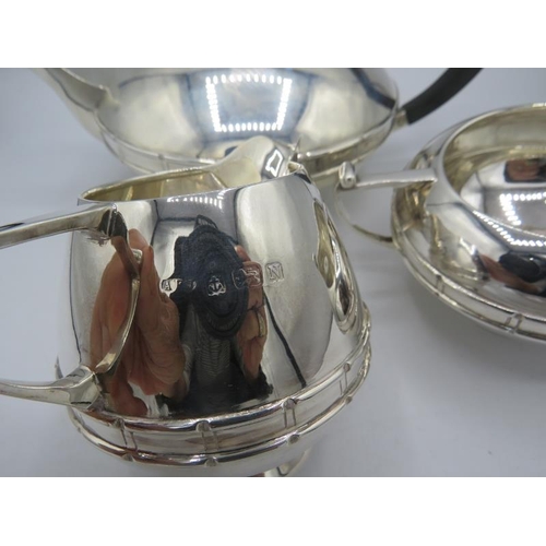 301 - A good quality Art Deco silver three piece tea service. Comprising of teapot, cream jug and sugar bo... 