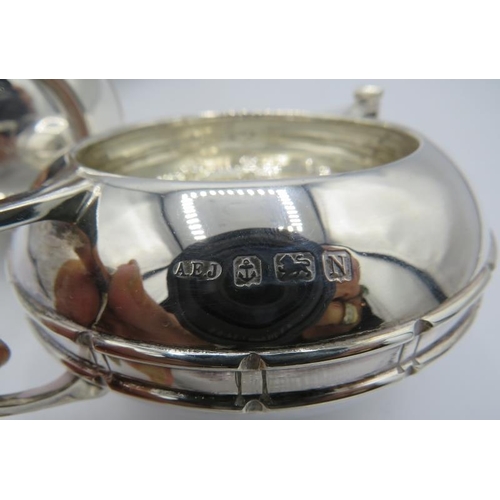 301 - A good quality Art Deco silver three piece tea service. Comprising of teapot, cream jug and sugar bo... 