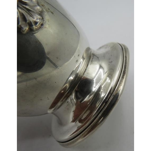 316 - A silver sugar caster with flower motif, Birmingham 1958, A.E Jones. Approx 7