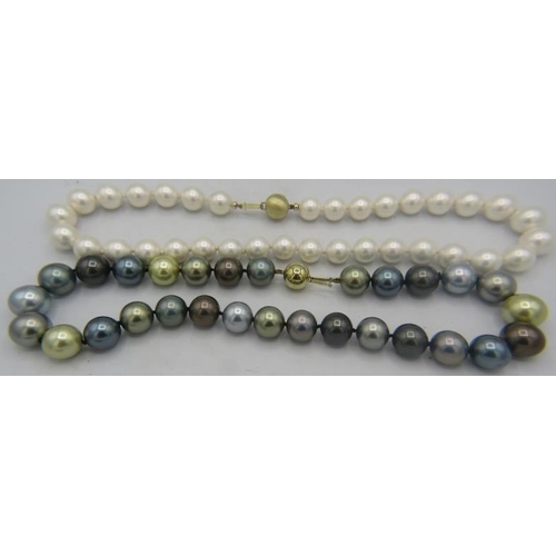 324 - A strand of South sea shell pearl necklace. Individually knotted with a 14ct yellow gold ball clasp.... 