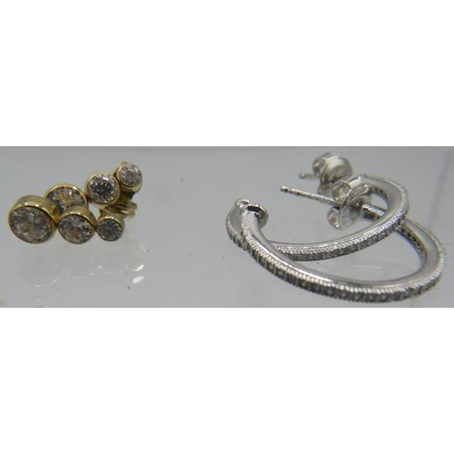 332 - A pair of yellow metal crystal quartz earrings, comprising of 3 graduated stones. one back 9ct the o... 