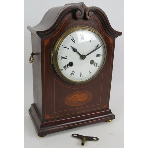 36 - An Edwardian striking mantle clock in an inlaid mahogany case and with enamel dial. Overall height 3... 