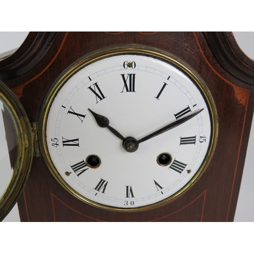 36 - An Edwardian striking mantle clock in an inlaid mahogany case and with enamel dial. Overall height 3... 