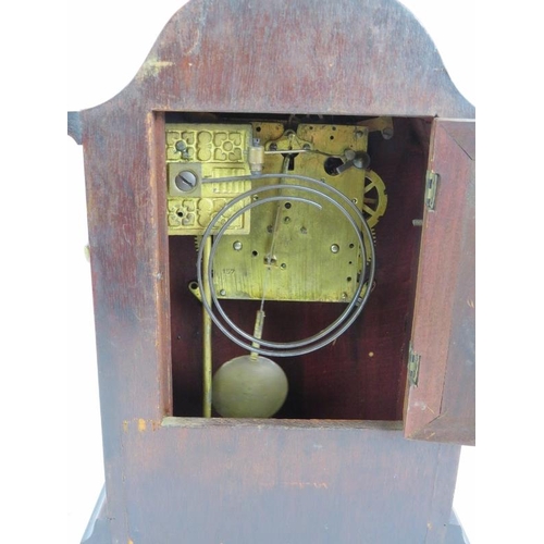 36 - An Edwardian striking mantle clock in an inlaid mahogany case and with enamel dial. Overall height 3... 