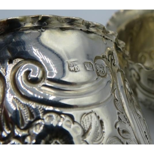 367 - A silver matching cream jug and sugar bowl, engraved with scrolls and foliate design. Sheffield 1897... 