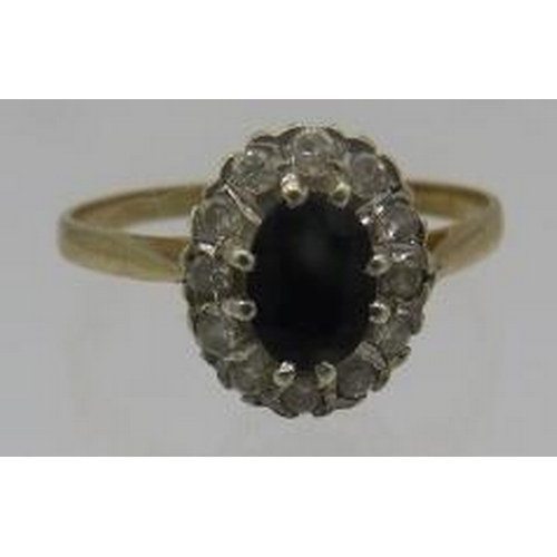 393 - A sapphire and diamond 9ct yellow gold cluster ting. Approx: 8mm x 5mm. Size T.
Condition report: Go... 