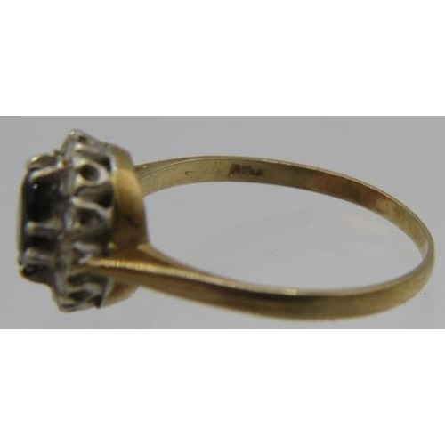 393 - A sapphire and diamond 9ct yellow gold cluster ting. Approx: 8mm x 5mm. Size T.
Condition report: Go... 