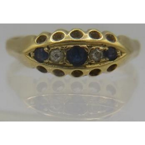 394 - An 18ct yellow gold sapphire and diamond ring set with 3 graduated sapphires and 2 small diamonds. S... 