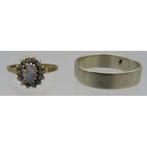 399 - A 9ct yellow gold opal cluster ring, size M, and a 9ct white gold wedding ring. 7 grams.
Condition r... 