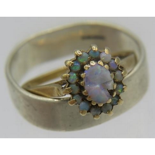 399 - A 9ct yellow gold opal cluster ring, size M, and a 9ct white gold wedding ring. 7 grams.
Condition r... 