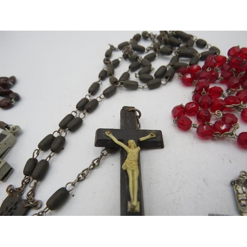 402 - A collection of 4 vintage roseries, including a souvenir from Lourdes, and one opening crucifix. A l... 