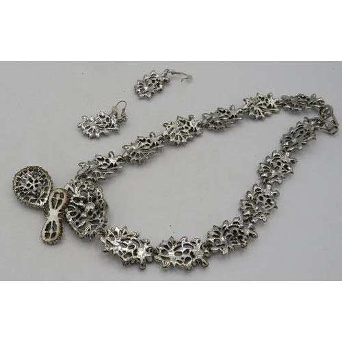 459 - A 1950's white metal style necklace with joined up links of sprays of flowers set with many stones s... 