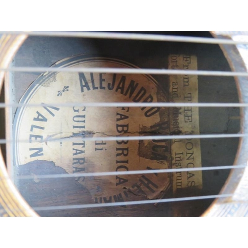 46 - A late 19th century inlaid Spanish guitar bearing a label for Alejandro Roca Y Hermanos, Valencia. L... 