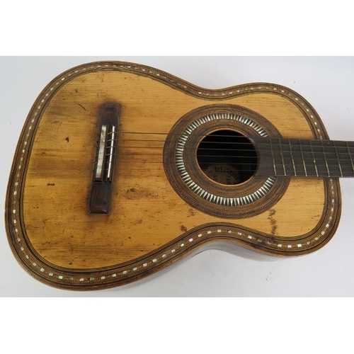 46 - A late 19th century inlaid Spanish guitar bearing a label for Alejandro Roca Y Hermanos, Valencia. L... 