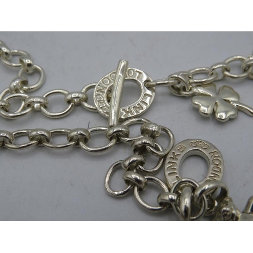 460 - A white metal chain link necklace with heart and four leaf clover charm. Heart marked 925. Marked Li... 