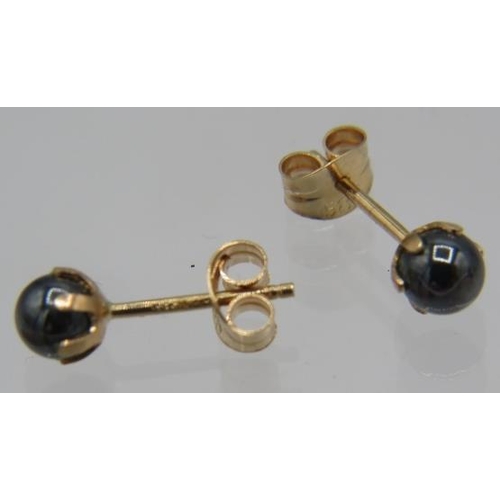 466 - A pair of 14ct yellow gold hermalite ball shaped earrings. Both posts and backs marked and a pair of... 