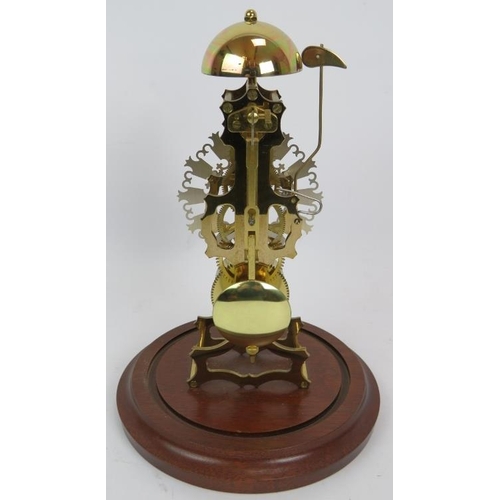 47 - A contemporary brass skeleton clock with German striking movement under a glass dome. No key. Overal... 