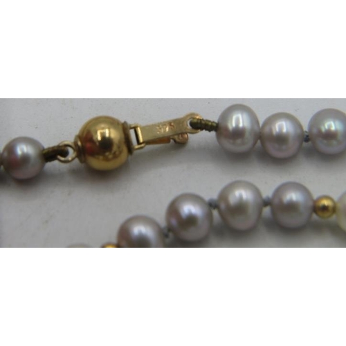 496 - A double strand pearl necklace with faux sapphire & diamond clasp. Approx: 18