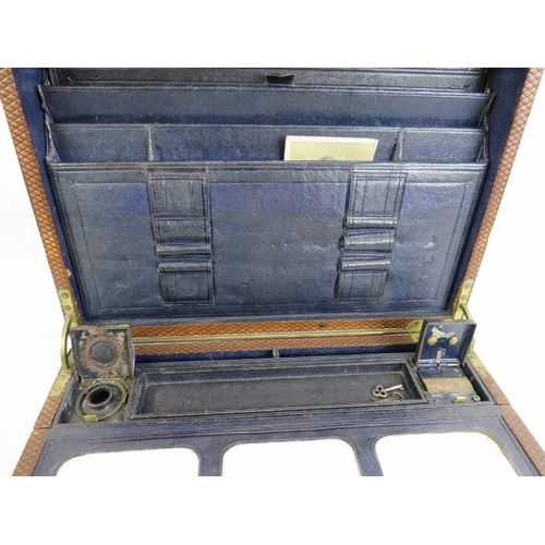 51 - A 19th century leather bound writing slope with brass fittings, Bramah lock and key, and fully fitte... 