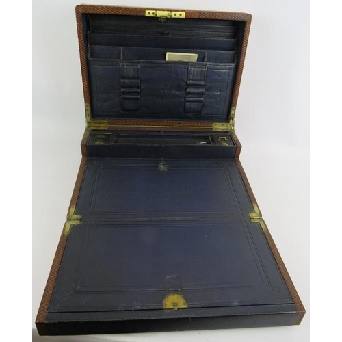 51 - A 19th century leather bound writing slope with brass fittings, Bramah lock and key, and fully fitte... 