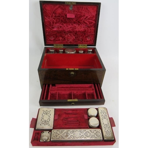 52 - A fine Regency Rosewood toilet box, fully fitted in red velvet with hallmarked silver topped jars, L... 