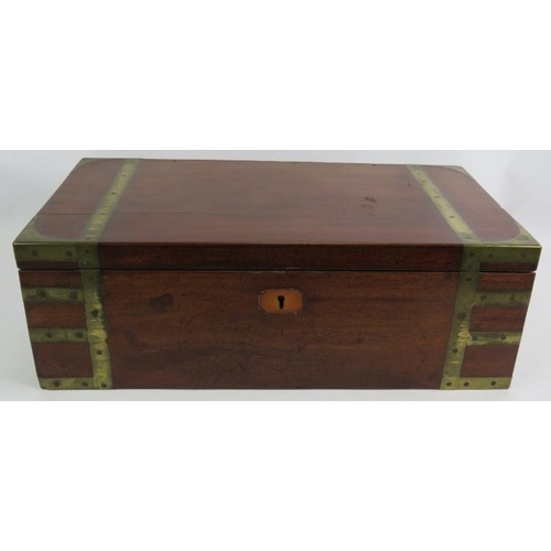 53 - A Regency period mahogany writing slope, brass bound with interior fittings, secret drawers and a do... 