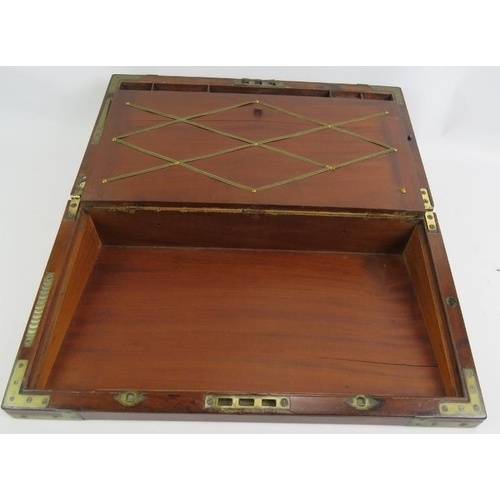 53 - A Regency period mahogany writing slope, brass bound with interior fittings, secret drawers and a do... 