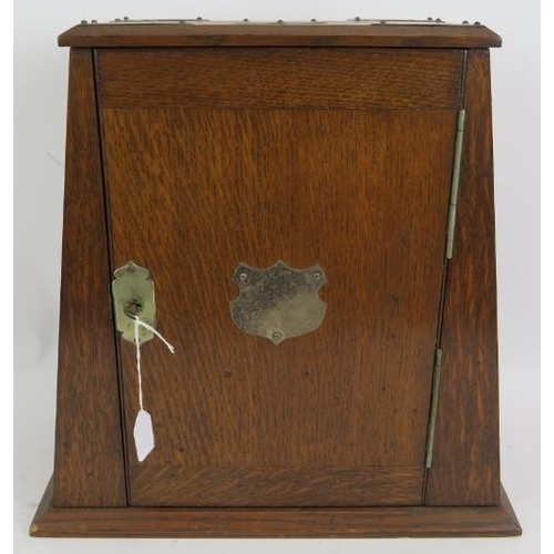 57 - An Edwardian oak smokers cabinet with plated mounts, two similar cigar/cigarette boxes and an antiqu... 